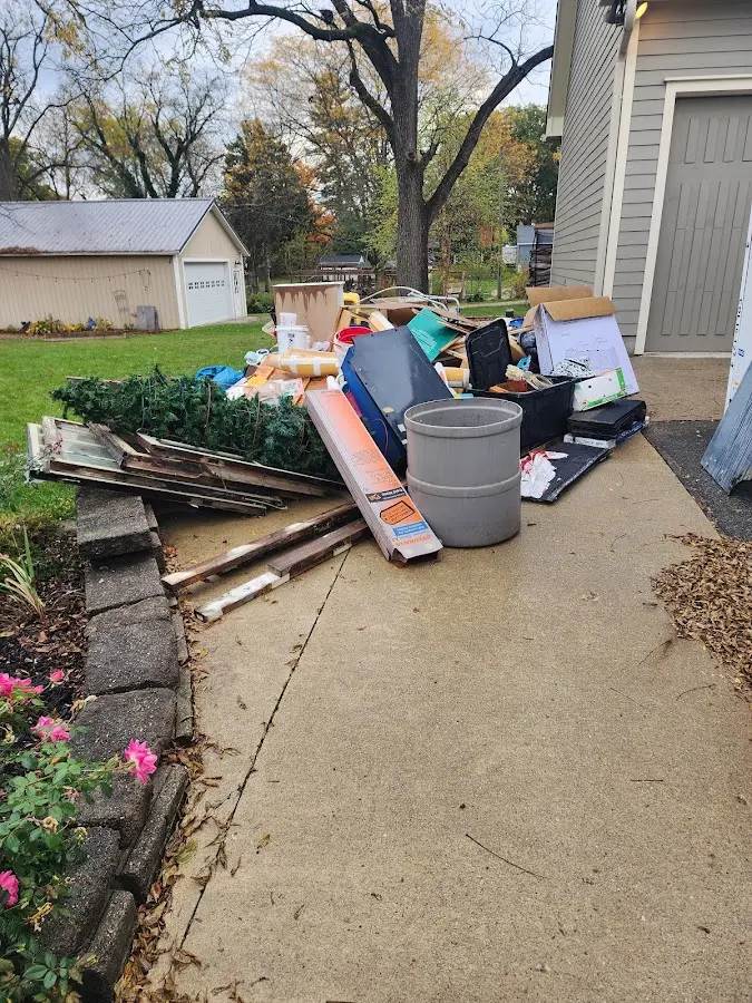 Dumpster being loaded with debris for 30 Yard Dumpster Rental in Everett